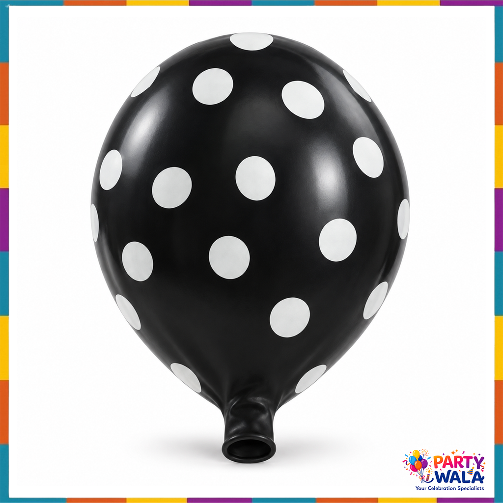 Inflated black balloon with white polka dots on a white background
