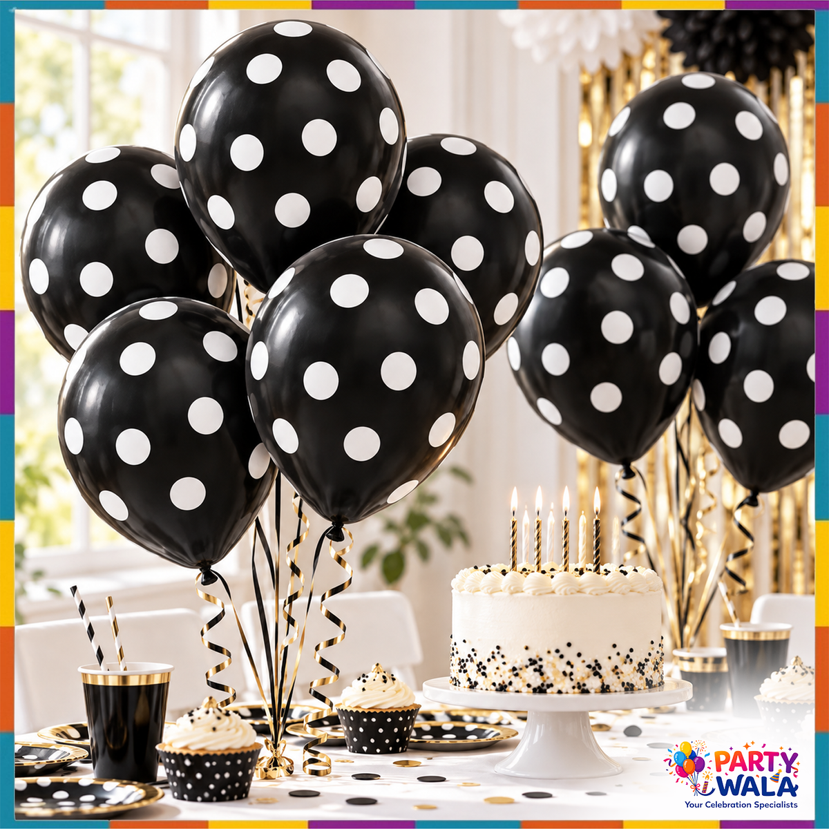 Black balloons with white polka dots displayed around a birthday cake and party table