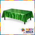 Green metallic foil tablecloth displayed on a rectangular party table
