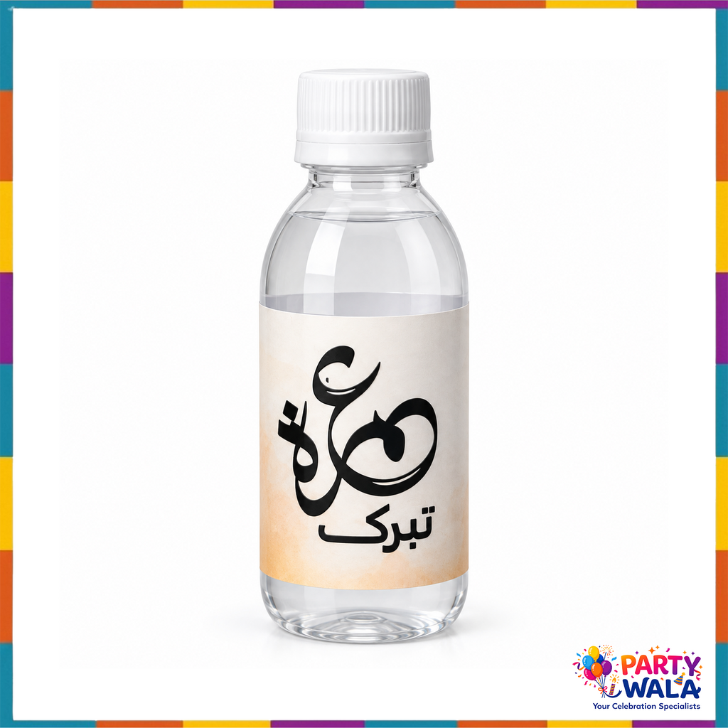 Orange Umrah Mubarak labeled Zamzam bottle