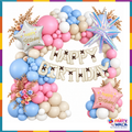 Pastel pink blue and cream birthday balloon garland with Happy Birthday foil letters and star balloons