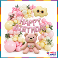 Pink teddy bear and smiling cloud birthday balloon garland in pink, cream and yellow