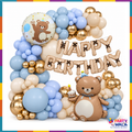 Teddy bear birthday decoration with blue cream gold balloon garland and Happy Birthday foil letters