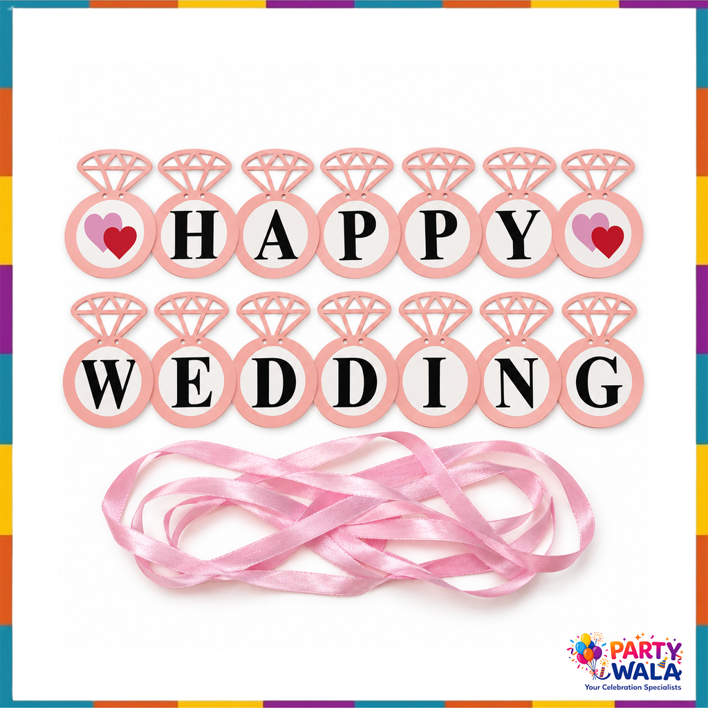 Pink Happy Wedding banner pieces with diamond-ring shapes, black letters, heart accents and ribbon